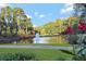 Serene pond with fountain and walking path at 5040 Harrington Rd, Johns Creek, GA 30022