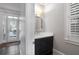 Chic powder room with dark vanity and modern fixtures at 5040 Harrington Rd, Johns Creek, GA 30022