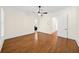 Bedroom with hardwood floors, crown molding, and a ceiling fan with light fixture at 3848 Saint Annes Ct, Duluth, GA 30096