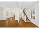 Bright living room with hardwood floors, white trim, and staircase leading to the upper level at 3848 Saint Annes Ct, Duluth, GA 30096