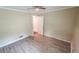 Bedroom with hardwood floors and ceiling fan at 1081 Avonridge Ct, Stone Mountain, GA 30083