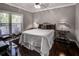 Cozy bedroom with a comfortable bed and dark hardwood floors at 2212 River Green Nw Dr, Atlanta, GA 30327