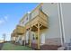 Rear view of townhouses with wooden decks and yards at 3750 Willingham Sw Run, Marietta, GA 30008