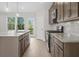 Modern kitchen with granite countertops and wooden cabinets at 3750 Willingham Sw Run, Marietta, GA 30008