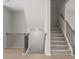 Modern staircase with black metal railings and light flooring at 3750 Willingham Sw Run, Marietta, GA 30008