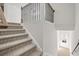 Modern staircase with black metal railings at 3750 Willingham Sw Run, Marietta, GA 30008