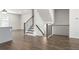 Modern staircase with dark wood and metal railing at 3750 Willingham Sw Run, Marietta, GA 30008