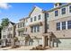 Front view of townhouses with garages and landscaping at 3750 Willingham Sw Run, Marietta, GA 30008