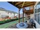 Outdoor patio featuring a wooden porch, lush landscaping, and green grass in a quiet setting at 3676 Chattahoochee Summit Dr, Atlanta, GA 30339