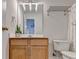 Well-lit bathroom featuring modern vanity with decorative light fixture and neutral color scheme at 3676 Chattahoochee Summit Dr, Atlanta, GA 30339
