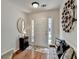 Open entryway featuring hardwood floors, a mirror, and a white front door offering lots of natural light at 3676 Chattahoochee Summit Dr, Atlanta, GA 30339