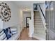 Inviting entryway featuring hardwood floors, staircase, and neutral paint colors providing a welcoming atmosphere at 3676 Chattahoochee Summit Dr, Atlanta, GA 30339