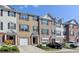 Attractive brick townhome featuring a one-car garage and manicured landscaping in an inviting community at 3676 Chattahoochee Summit Dr, Atlanta, GA 30339