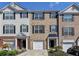 Charming brick townhome featuring a one-car garage and well maintained landscaping in a desirable location at 3676 Chattahoochee Summit Dr, Atlanta, GA 30339