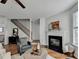 Inviting living area with a fireplace, staircase, and hardwood floors at 3676 Chattahoochee Summit Dr, Atlanta, GA 30339