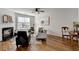 Inviting living room with fireplace, hardwood floors, and large windows for natural light at 3676 Chattahoochee Summit Dr, Atlanta, GA 30339