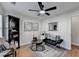 Relaxing sitting room featuring natural light, ceiling fan, modern furniture, and a neutral color palette at 3676 Chattahoochee Summit Dr, Atlanta, GA 30339