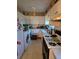 Bright kitchen with white cabinets and appliances at 3751 Amber Nw Rd, Atlanta, GA 30331