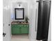 Well-lit bathroom with a green vanity, shower, and essential toiletries at 2700 Pine Tree Ne Rd # 2108, Atlanta, GA 30324