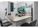 Modern kitchen with stainless steel appliances, breakfast bar, and stylish hanging light fixture at 2700 Pine Tree Ne Rd # 2108, Atlanta, GA 30324