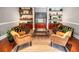 Entertainment space with sofas, armchairs, sleek shelving, and a large television at 2700 Pine Tree Ne Rd # 2108, Atlanta, GA 30324