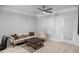 Bright living room with modern furnishings, ceiling fan and access to exterior at 2700 Pine Tree Ne Rd # 2108, Atlanta, GA 30324