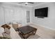 Bright living room with modern furnishings, ceiling fan and large flatscreen TV at 2700 Pine Tree Ne Rd # 2108, Atlanta, GA 30324