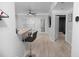 Open living space features a breakfast bar, plank flooring, and access to a bedroom and exterior at 2700 Pine Tree Ne Rd # 2108, Atlanta, GA 30324