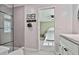 Modern bathroom with gray tile shower and view of bedroom at 160 Isleworth Way, Fayetteville, GA 30215