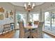 Bright breakfast nook with wicker chairs and view of backyard at 160 Isleworth Way, Fayetteville, GA 30215