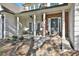 Inviting front porch with stone accents and columns at 160 Isleworth Way, Fayetteville, GA 30215