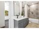 Modern bathroom with double vanity, quartz countertop, and tiled shower at 971 Washington Sw Pl, Atlanta, GA 30314