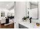 Stylish powder room featuring a modern vanity with quartz countertop, sleek faucet, and contemporary design elements at 971 Washington Sw Pl, Atlanta, GA 30314