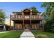 Charming two-story home with double balconies, beautiful landscaping, and a welcoming entrance at 971 Washington Sw Pl, Atlanta, GA 30314