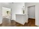 Hallway featuring hardwood floors and open doorways to the adjacent bedroom and en-suite bathroom at 971 Washington Sw Pl, Atlanta, GA 30314