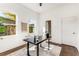 Well-lit home office with hardwood floors, a contemporary desk, and a view into the en-suite bathroom at 971 Washington Sw Pl, Atlanta, GA 30314