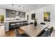Bright kitchen with gray cabinets, quartz countertops, and a seamless transition to the dining area for entertaining at 971 Washington Sw Pl, Atlanta, GA 30314