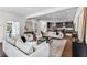 Open-concept living room boasts hardwood floors, comfortable seating, and a seamless flow to the kitchen at 971 Washington Sw Pl, Atlanta, GA 30314