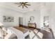 Bright main bedroom with a tray ceiling, hardwood floors, an en-suite bathroom, and sophisticated decor at 971 Washington Sw Pl, Atlanta, GA 30314