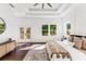 Bright main bedroom with tray ceiling, modern decor, and balcony access at 971 Washington Sw Pl, Atlanta, GA 30314