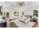 Spacious main bedroom with tray ceilings, hardwood floors, and multiple windows with a walk out deck at 971 Washington Sw Pl, Atlanta, GA 30314