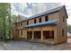 This shot shows a partially completed two-story home with exposed framework and a connected, open garage area at 440 Allyson Cir, Alpharetta, GA 30009