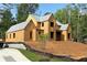 Unfinished home exterior showing the frame, gray roof, framed window openings, and raw sheathing at 440 Allyson Cir, Alpharetta, GA 30009