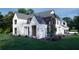 Gorgeous new construction home with dark window frames, landscaped front yard, and long driveway at 440 Allyson Cir, Alpharetta, GA 30009