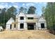 New construction home boasting a modern design, large windows, and a spacious layout in a wooded location at 440 Allyson Cir, Alpharetta, GA 30009