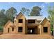 Unfinished two-story home featuring a gable roof, framed windows, and wood sheathing at 440 Allyson Cir, Alpharetta, GA 30009