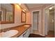 Bathroom with double sinks, stylish mirrors and vanity at 26 Flint Ridge Se Dr, Mableton, GA 30126