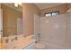 Bathroom with a single vanity, a toilet, and tiled shower-over-tub at 26 Flint Ridge Se Dr, Mableton, GA 30126