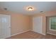Comfortable bedroom featuring neutral paint, closet, and ample natural light at 26 Flint Ridge Se Dr, Mableton, GA 30126