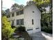 Two-story house with white siding, green shutters, and a two-car garage at 26 Flint Ridge Se Dr, Mableton, GA 30126